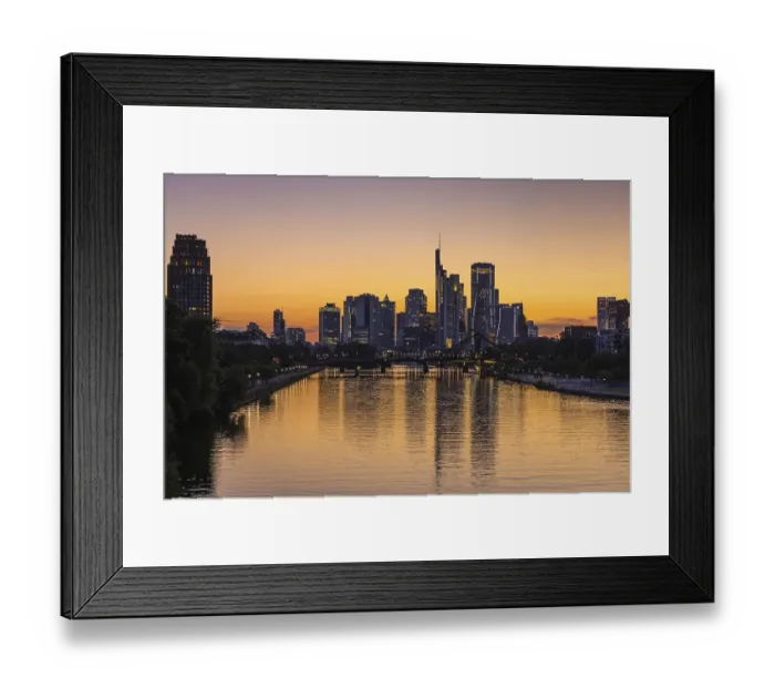 Framed Print : The lights of Frankfurt's banking skyline begin to glow in the evening after sunset