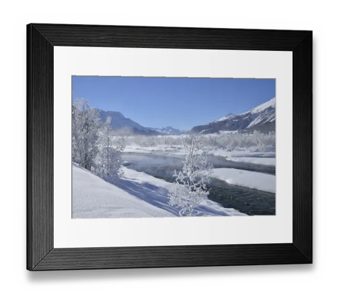 Framed Print : Snow-covered landscape and the Inn River