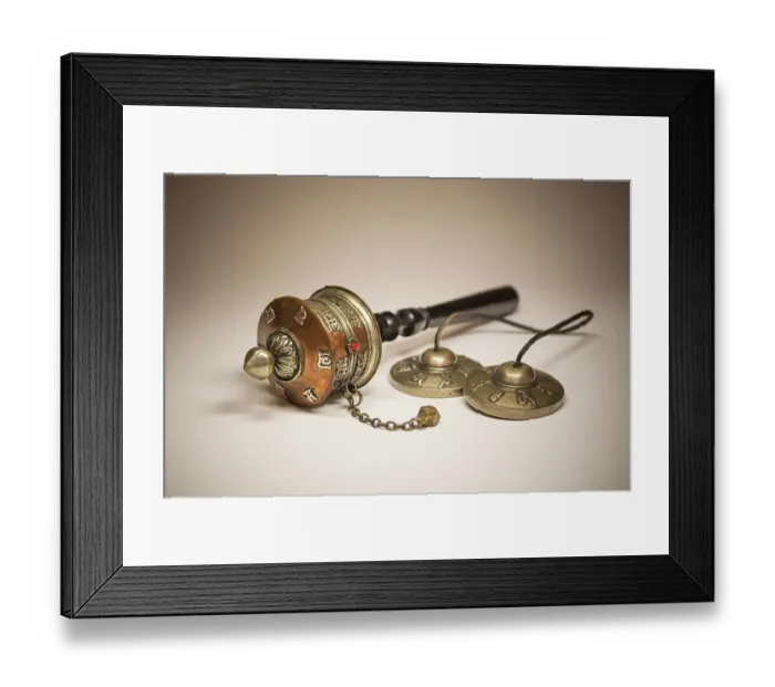 Framed Print : A Tibetan prayer mill and cymbals