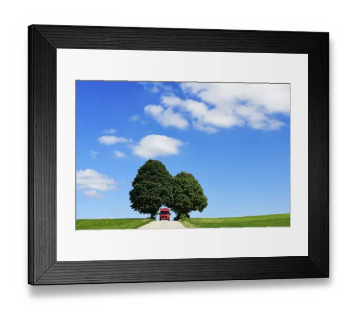 Framed Print : Motorhome on picture book country road near Berg