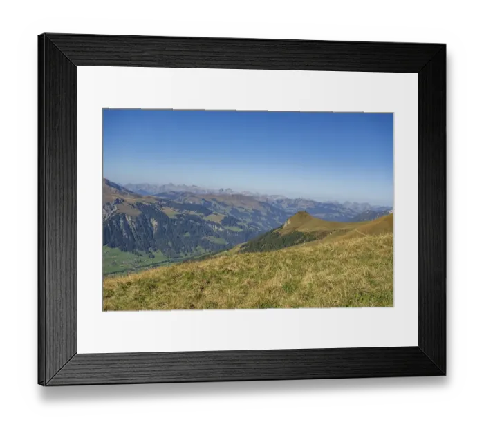 Framed Print : Landscape photograph of mountains and valleys in the Alps on a clear Framed Print : Landscape photograph of mountains and valleys in the Alps on a clear