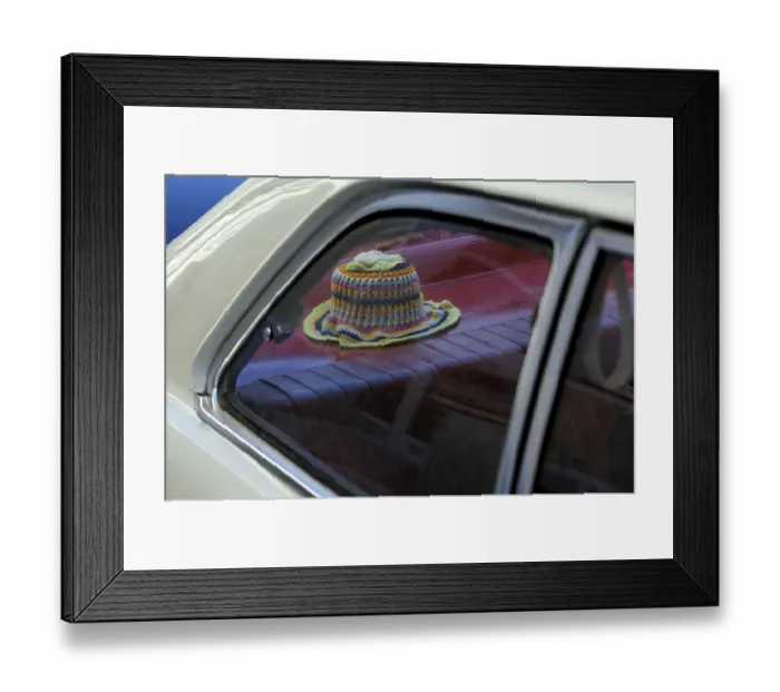 Framed Print : Crocheted toilet paper hat on the stacking of a vintage car