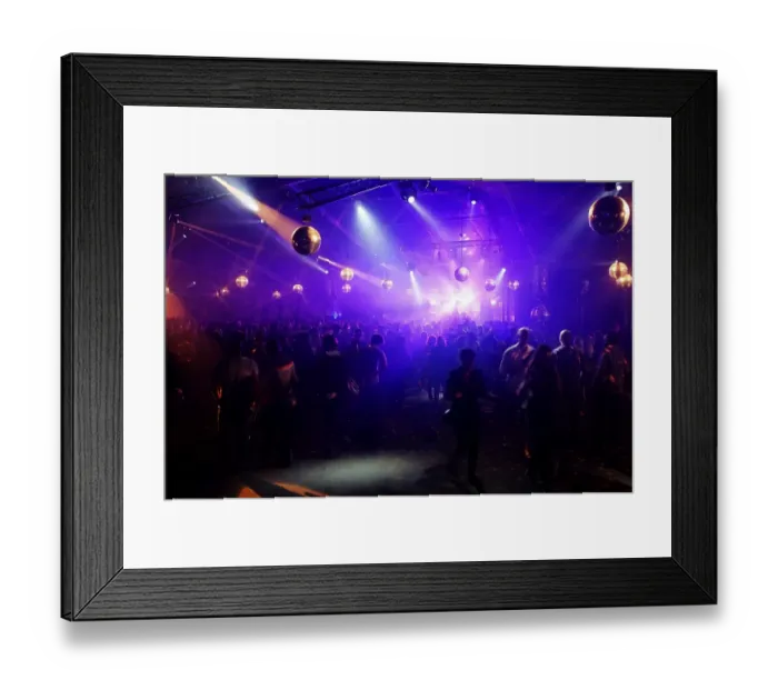 Framed Print : DJ entertaining a crowd in a party tent