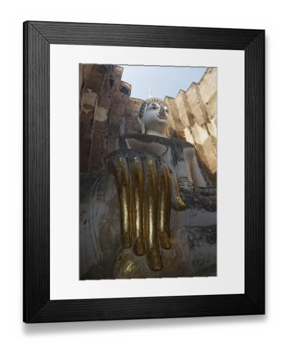 Framed Print : Gold-plated hand of the Seated Buddha statue of Phra Achana in Wat Si Chum Temple