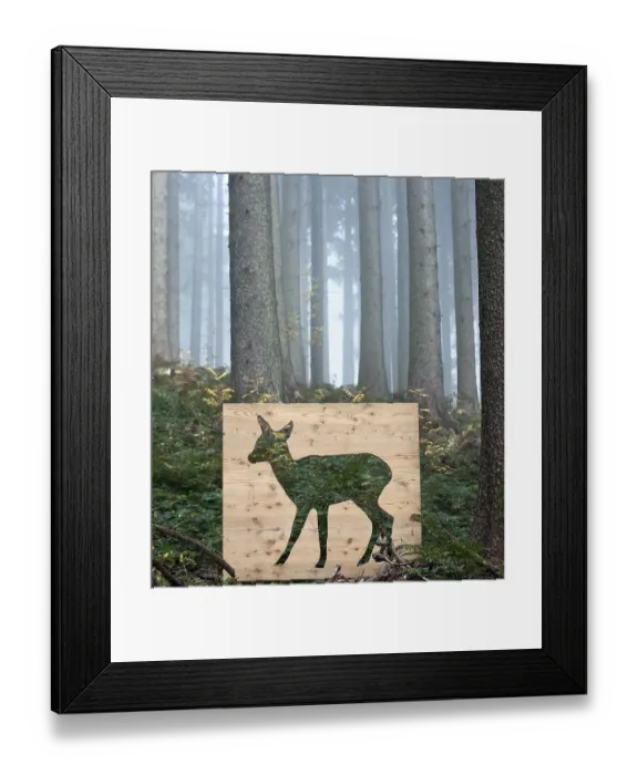 Framed Print : Wooden stencil of a deer in a forest