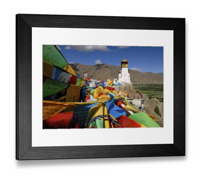 Framed Print : Prayer flags are flying on Yumbulagang Palace above the Yarlung Valley