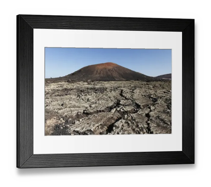 Framed Print : Montana Negra volcano, lava field
