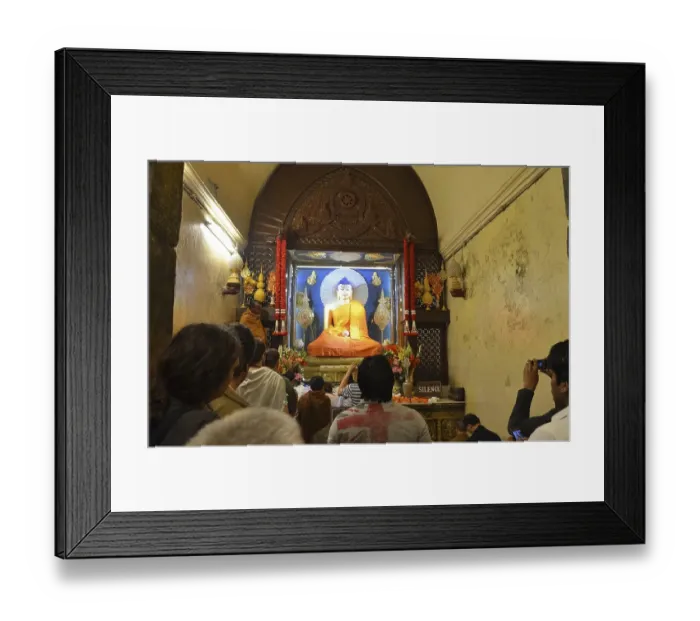 Framed Print : Buddhists in front of a Buddha statue