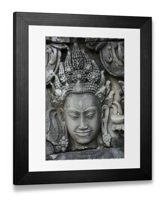 Framed Print : Stone carving of a female face
