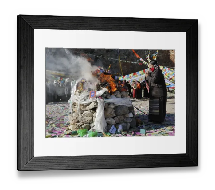 Framed Print : Pilgrim praying during a ceremony at Namtso Lake
