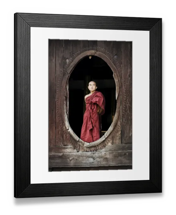 Framed Print : Buddhist monk standing at a window Framed Print : Buddhist monk standing at a window