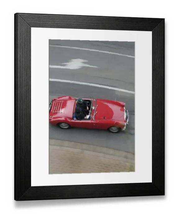 Framed Print : Red vintage car MG driving and from above Framed Print : Red vintage car MG driving and from above