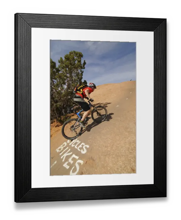 Framed Print : Mountain biker on Slickrock Trail
