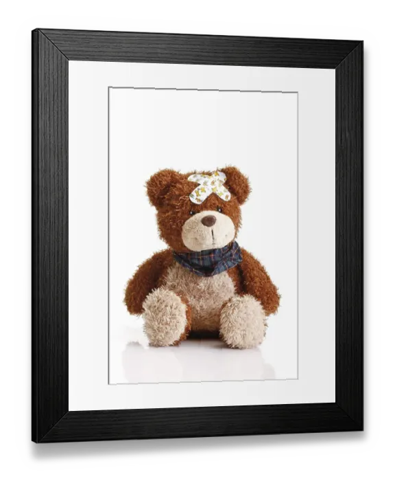 Framed Print : Teddy bear with band-aids on its head