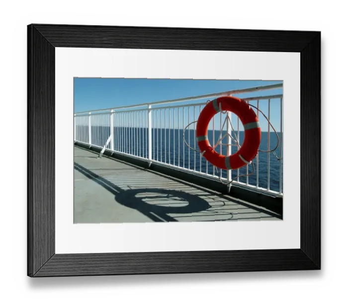 Framed Print : Lifebelt at railing on the sundeck of a ship