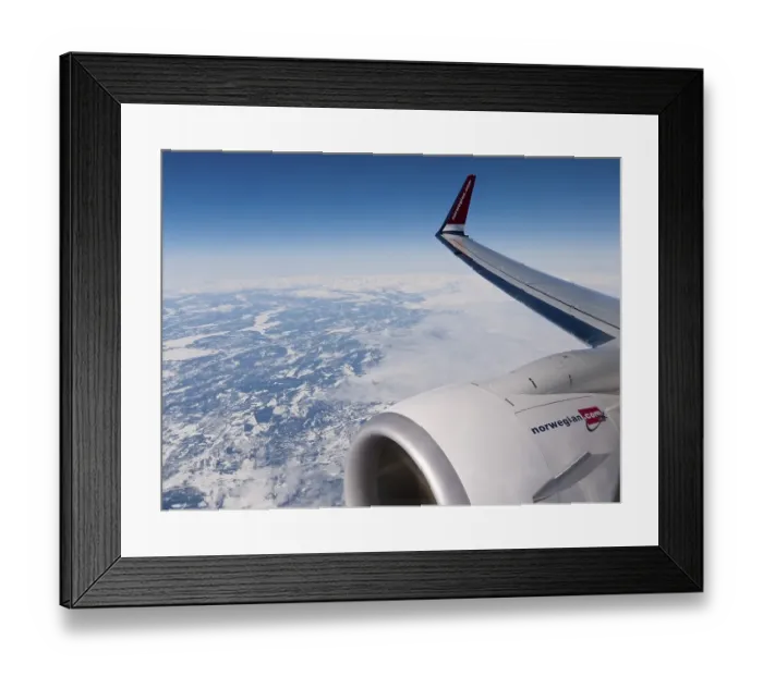 Framed Print : Plane of the Norwegian Airlines flying over the snow-covered Kiruna Framed Print : Plane of the Norwegian Airlines flying over the snow-covered Kiruna