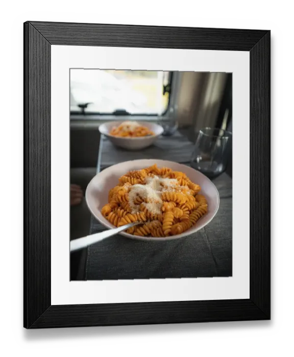 Framed Print : Cooked fusilli with tomato sauce and parmesan cheese on the table in the campervan