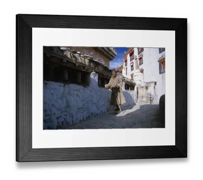 Framed Print : Old man turning prayer wheels in Lamayuru Gompa Framed Print : Old man turning prayer wheels in Lamayuru Gompa