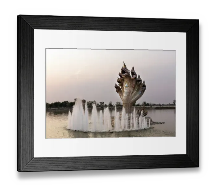 Framed Print : Seven-headed Naga serpent and fountain in front of the Elephant Temple Thep Wittayakhom Vihara