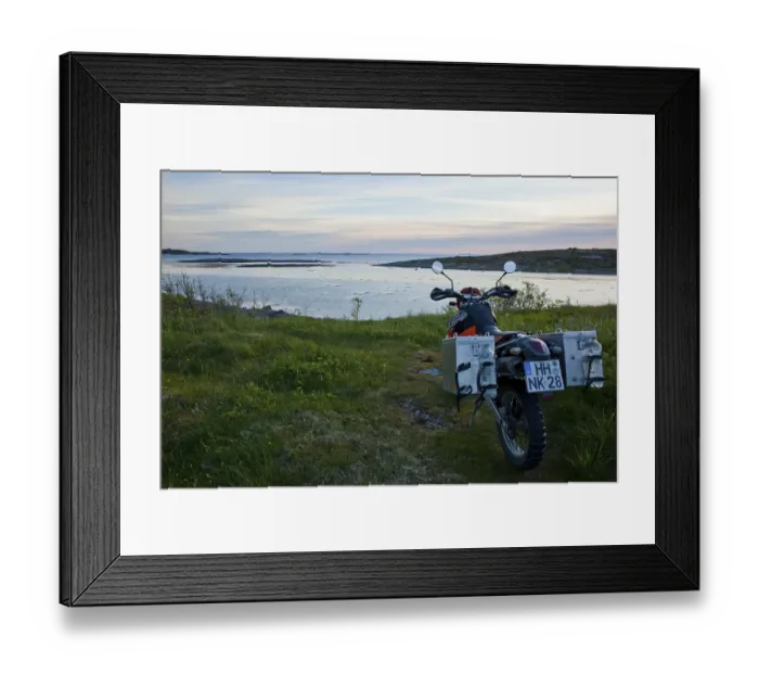 Framed Print : Enduro motorcycle on the Norwegian coast in the evening twilight Framed Print : Enduro motorcycle on the Norwegian coast in the evening twilight