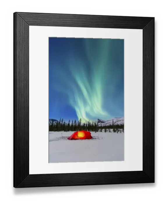 Framed Print : Northern Lights (Aurora borealis) above a red illuminated tent in winter