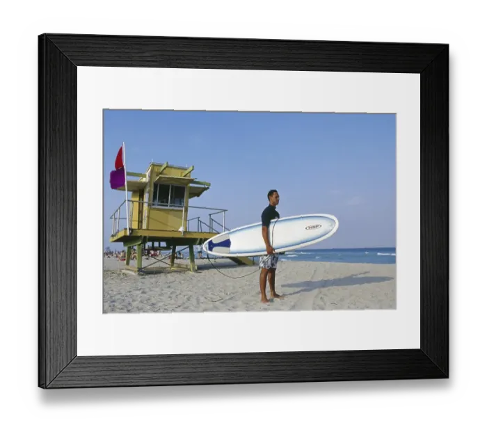 Framed Print : Surfer with his board under his arm Framed Print : Surfer with his board under his arm