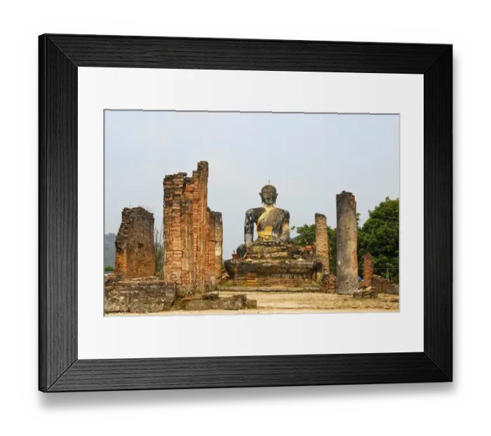 Framed Print : Ancient buddha statue and columns of the buddhist temple of Wat Phia Wat destroyed in the Vietnam war Framed Print : Ancient buddha statue and columns of the buddhist temple of Wat Phia Wat destroyed in the Vietnam war