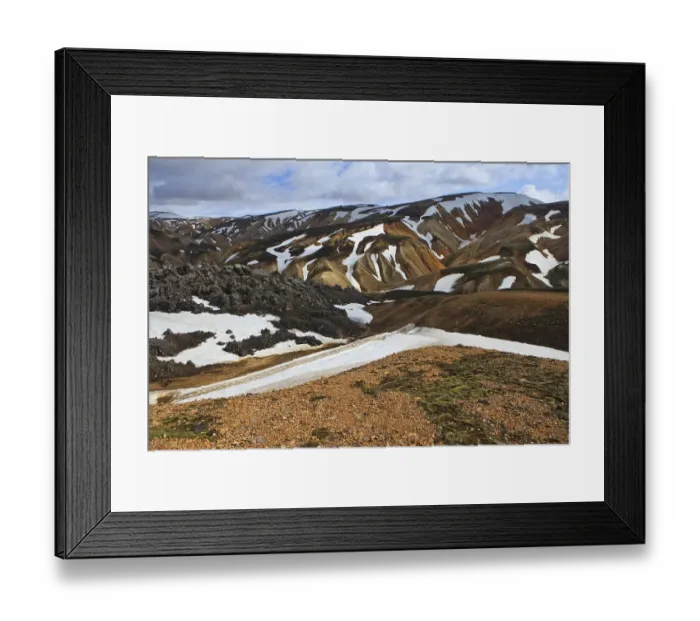 Framed Print : Cooled lava field with snow fields in a volcanic landscape