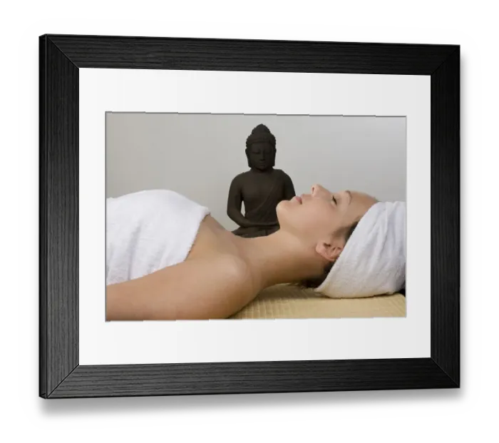 Framed Print : Young woman next to a Buddha statue Framed Print : Young woman next to a Buddha statue