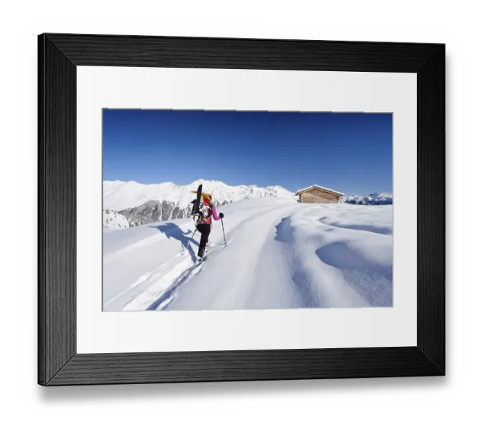 Framed Print : Snowshoer during the ascent to Jagelealm alp in the Ridnauntal valley above Entholz