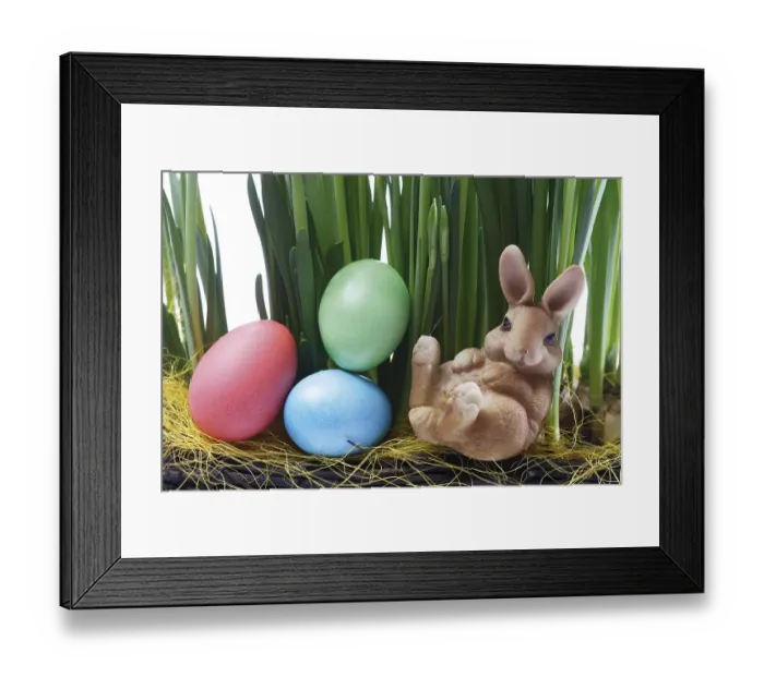 Framed Print : Easter bunny with Easter eggs sitting between daffodil stalks Framed Print : Easter bunny with Easter eggs sitting between daffodil stalks