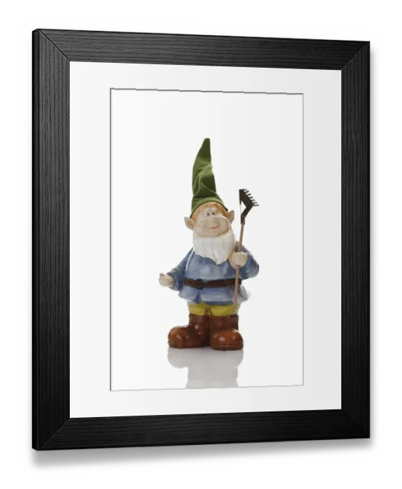 Framed Print : Garden gnome wearing pointed hat holding a rake Framed Print : Garden gnome wearing pointed hat holding a rake