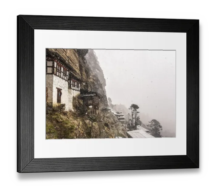 Framed Print : Buddhist nunnery in the mountains during snowfall