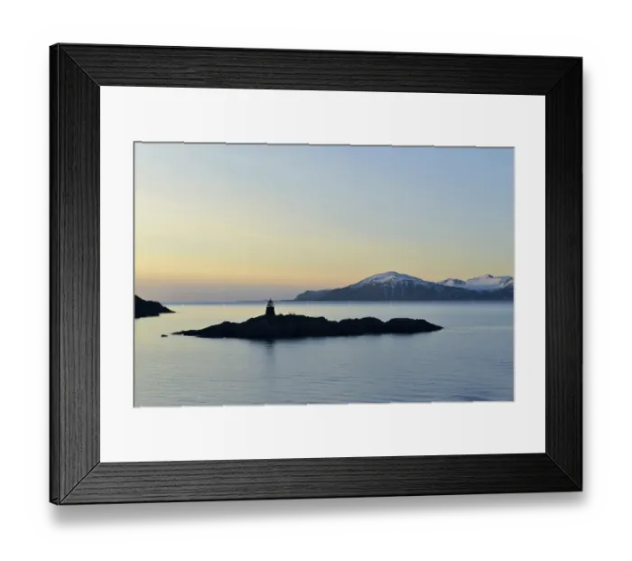 Framed Print : Silhouette of a small island with a lighthouse in the evening Framed Print : Silhouette of a small island with a lighthouse in the evening
