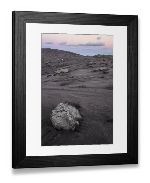 Framed Print : Volcanic bombs, lava rock on the edge of the crater of Mount Yasur volcano in the morning light