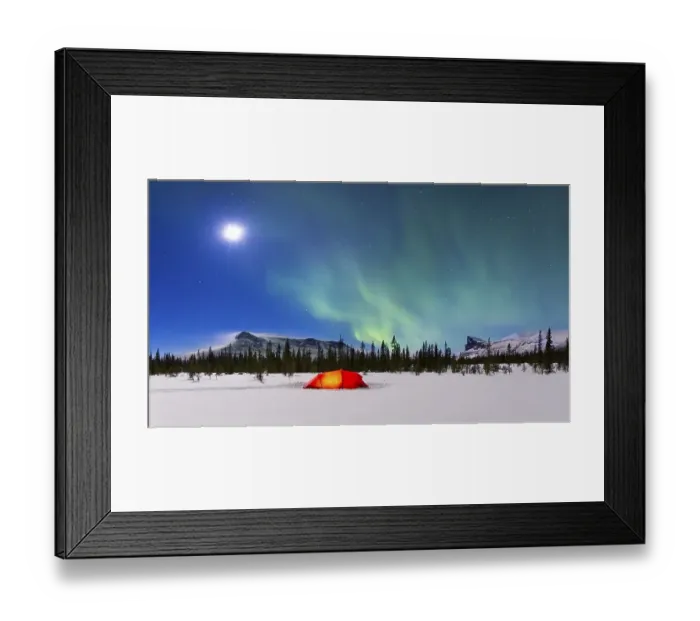 Framed Print : Northern Lights (Aurora borealis) above a red illuminated tent in winter