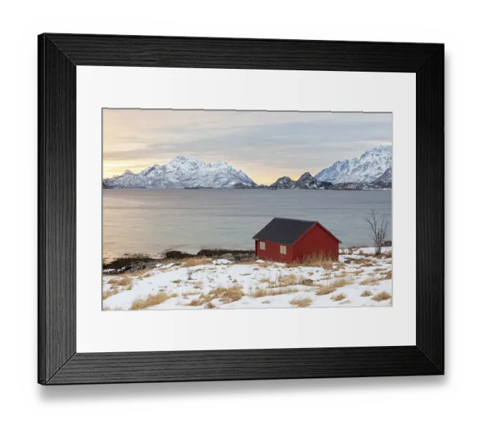 Framed Print : Red house at a fjord in winter