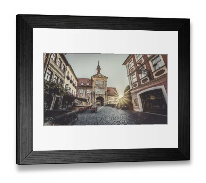 Framed Print : Sunrise through the gate of a historic building in a European old town