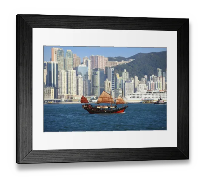 Framed Print : Traditional sailboat, junk in front of the skyline Framed Print : Traditional sailboat, junk in front of the skyline