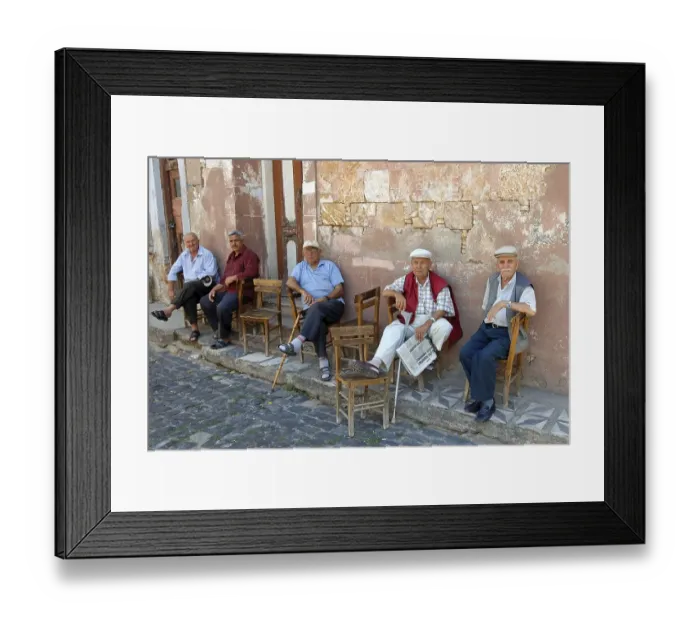 Framed Print : Turkish men sitting in front of house