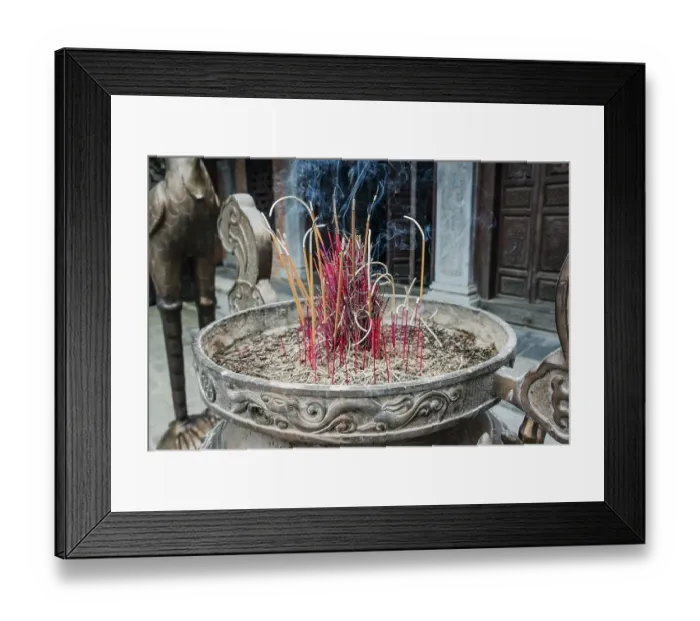 Framed Print : Incense sticks burning in a container in front of a Buddhist temple at Trang An Grottoes in the Trang An Scenic Framed Print : Incense sticks burning in a container in front of a Buddhist temple at Trang An Grottoes in the Trang An Scenic