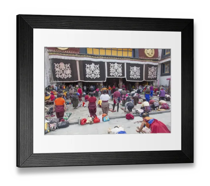 Framed Print : Buddhists pray in front of Jokhang Temple in Lhasa