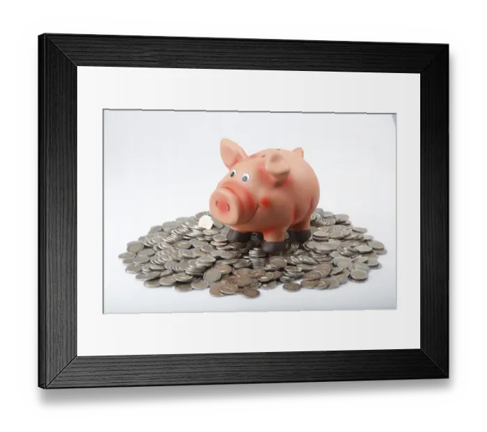 Framed Print : Piggy bank on a pile of euro coins