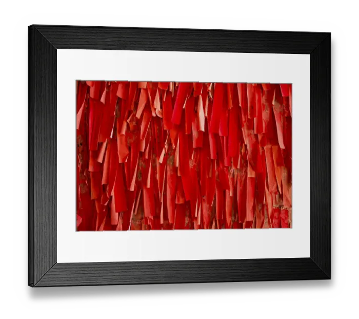 Framed Print : Red luck or wishing papers on a wall in the temple