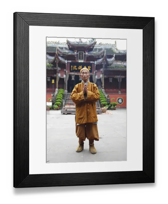 Framed Print : Monk, 85 years old, in front of Buddhist temple