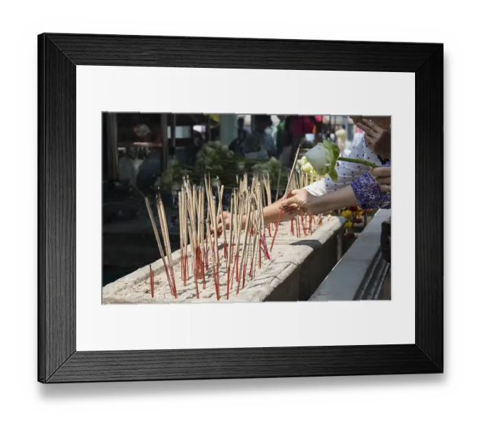 Framed Print : Believers lighting incense sticks
