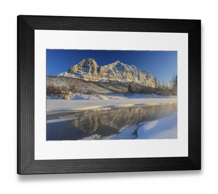 Framed Print : Snowy steep mountains reflected in frozen river Framed Print : Snowy steep mountains reflected in frozen river