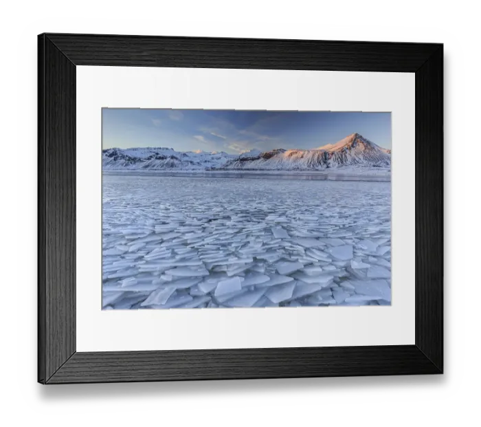 Framed Print : Ice floes on a lake in front of snowy mountains Framed Print : Ice floes on a lake in front of snowy mountains