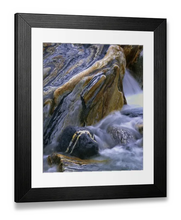 Framed Print : Stones with rock veins and running water