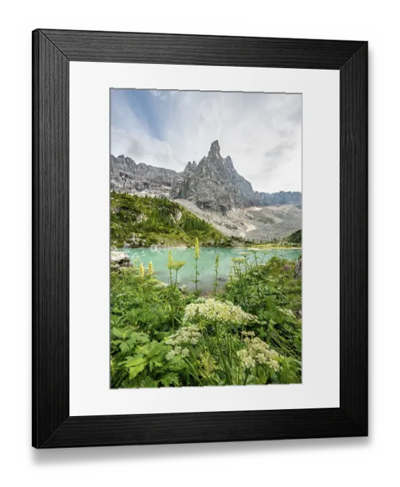Framed Print : Turquoise-green Sorapis lake with flowers